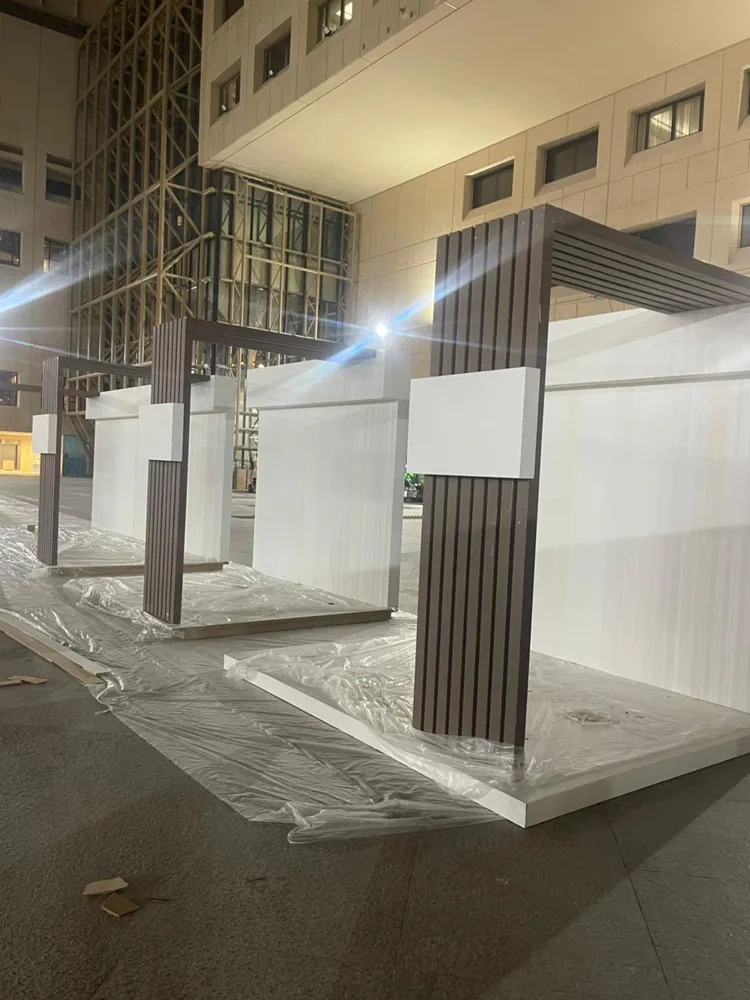 Slatted booth structures during installation